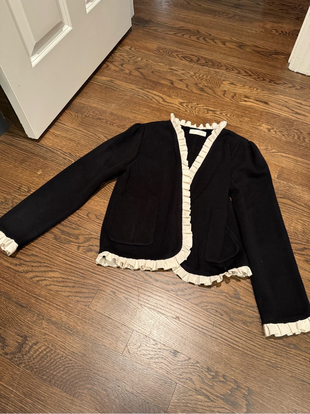 Vita Grace women’s Black sweater/Jacket with Cream Ruffle Trim
